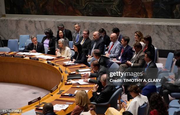 Secretary of State Antony Blinken , with US Ambassador to the UN Linda Thomas-Greenfield , listens during the United Nations Security Council meeting...