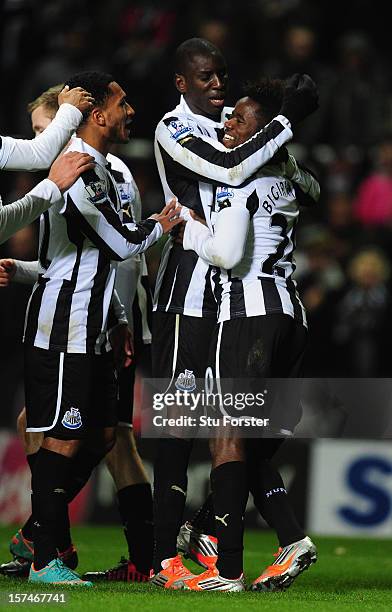 Newcastle scorer Gael Bigirimana is congratulated by Demba Ba after the third goal during the Barclays Premier League match between Newcastle United...