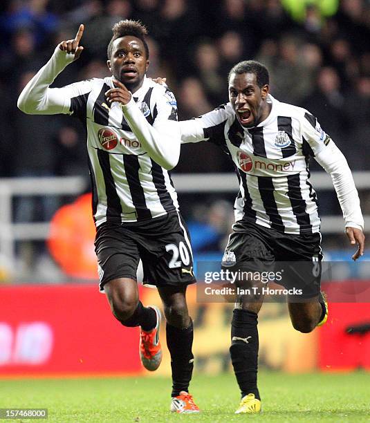 Gael Bigirimana celebrates scoring the third goal with Vurnon Anita during the Barclays Premier League match between Newcastle United and Wigan...