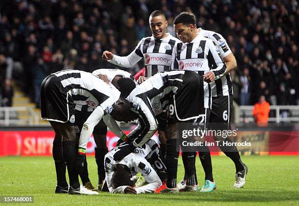 Gael Bigirimana celebrates scoring the third goal during the Barclays Premier League match between Newcastle United and Wigan Athletic at St James'...