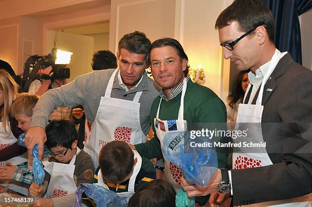 Peter Artner and Frenkie Schinkels attend the Celebrity Charity Christmas Baking at Parkhotel Schoenbrunn on December 3, 2012 in Vienna, Austria.