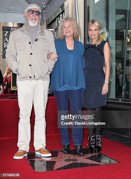 Record producer Lou Adler, recording artist Carole King and actress Kristin Chenoweth attend King being honored with a Star on the Hollywood Walk of...