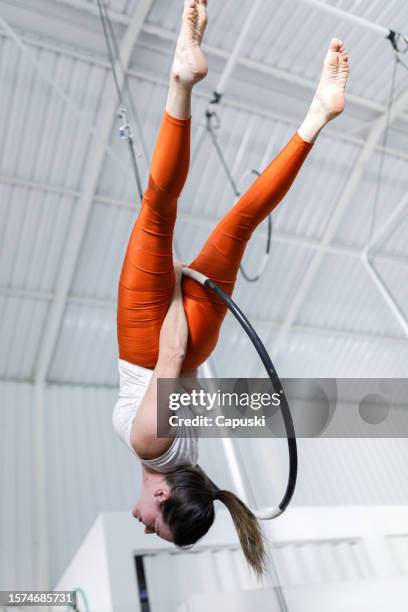 woman doing gymnastics with a lyra hoop - lyra stock pictures, royalty-free photos & images