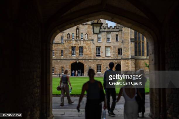 People visit New College on August 3, 2023 in Oxford, England. Oxford's city council proposed a 20-year urban plan for "15-minute" neighbourhoods,...