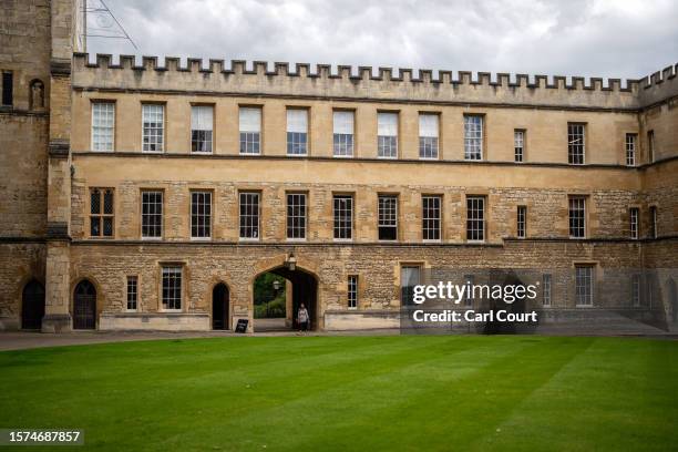 Visitor walks around a lawn at New College on August 3, 2023 in Oxford, England. Oxford's city council proposed a 20-year urban plan for "15-minute"...