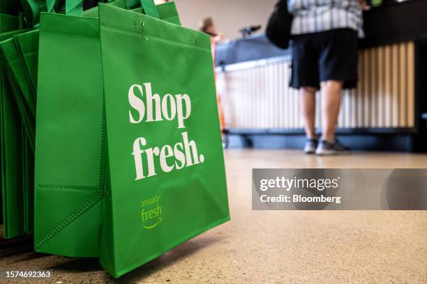 Reusable shopping bags for sale at an Amazon Fresh grocery store in Schaumburg, Illinois, US, on Monday, July 24, 2023. Amazon.com Inc. Is launching...