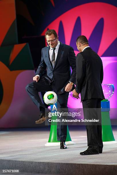 Cafu, Brazilian soccer player and Jerome Valcke play with the ball “Cafusa” during the Draw for the FIFA Confederations Cup 2013 at Anhembi...