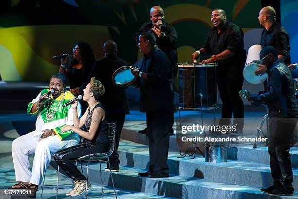 Brazilian singers Arlindo Cruz and Maria Gadu sing during the Draw for the FIFA Confederations Cup 2013 at Anhembi Convention Center on December 01,...