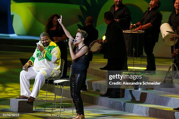 Brazilian singers Arlindo Cruz and Maria Gadu sing during the Draw for the FIFA Confederations Cup 2013 at Anhembi Convention Center on December 01,...