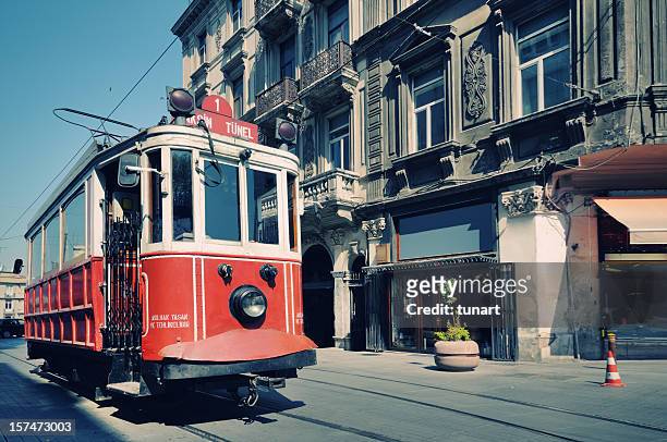 cable car in street of istiklal, beyoglu, istanbul, turkey - istiklal avenue stock pictures, royalty-free photos & images