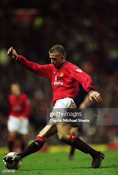 David Beckham of Manchester United runs with the ball during the FA Barclaycard Premiership match against Sunderland played at Old Trafford, in...