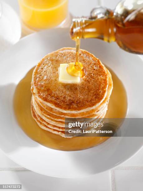 pancakes with maple syrup and butter - maple syrup pancakes stock pictures, royalty-free photos & images