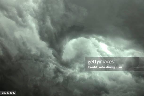 dark gray swirling storm clouds - blizzard stock pictures, royalty-free photos & images