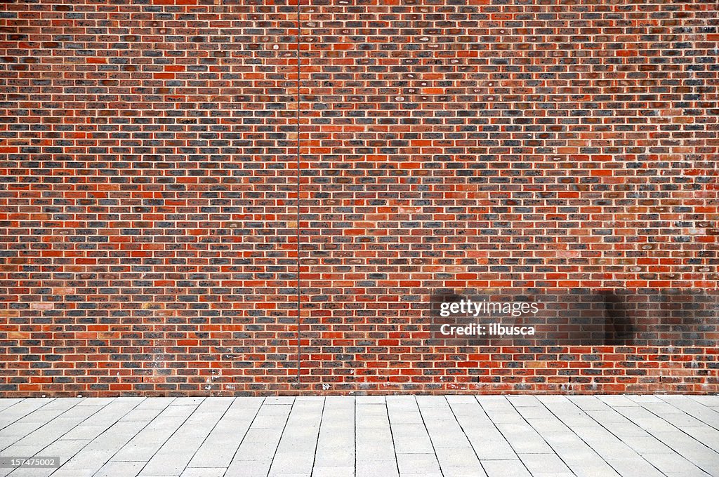 Urban background UK - Red brick wall with sidewalk