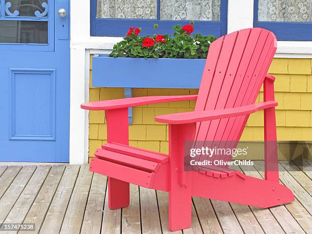 red adirondak chair. - adirondack chair stock pictures, royalty-free photos & images