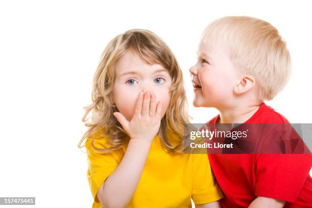 little boy whispering secret - whispering stock pictures, royalty-free photos & images