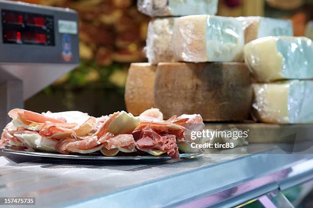 display of parma hams and cheeses - parma italy stock pictures, royalty-free photos & images