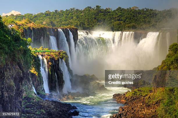 iguazu falls - uruguay v brazil stock-fotos und bilder