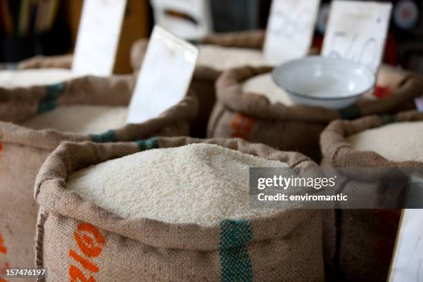 thai rice for sale in a market. - rijst stapelvoedsel stockfoto's en -beelden
