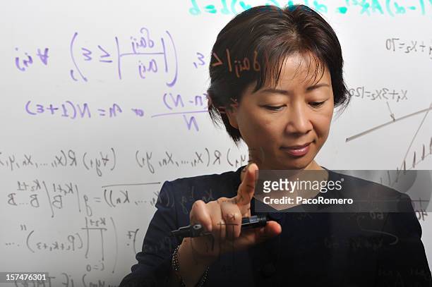 female mathematician at work - mathematician stock pictures, royalty-free photos & images