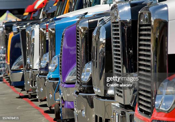 row of trucks - radiator grille stock pictures, royalty-free photos & images