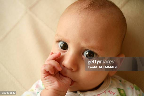 baby thumb sucking - thumb sucking stock pictures, royalty-free photos & images
