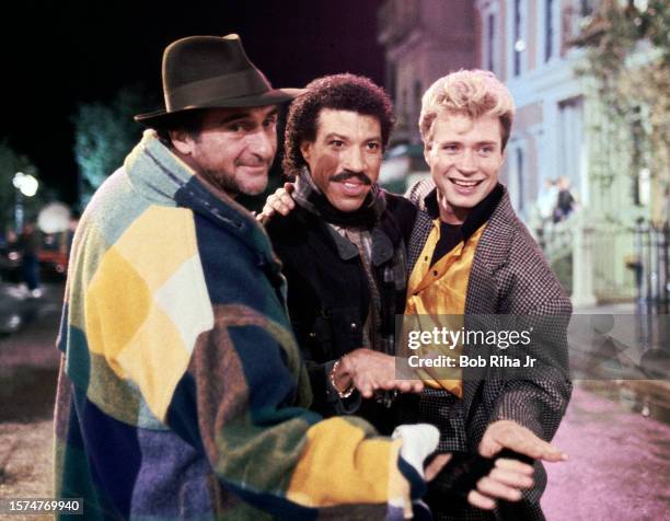 Performer Lionel Richie with Director Bob Giraldi and Choreographer Vince Paterson during break while filming a Pepsi commercial at Universal Studios...