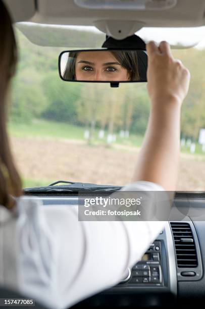 woman driver - rear view mirror stock pictures, royalty-free photos & images