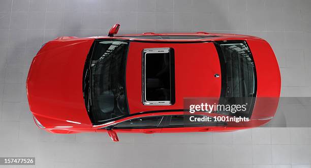 red sports car - car sunroof stockfoto's en -beelden