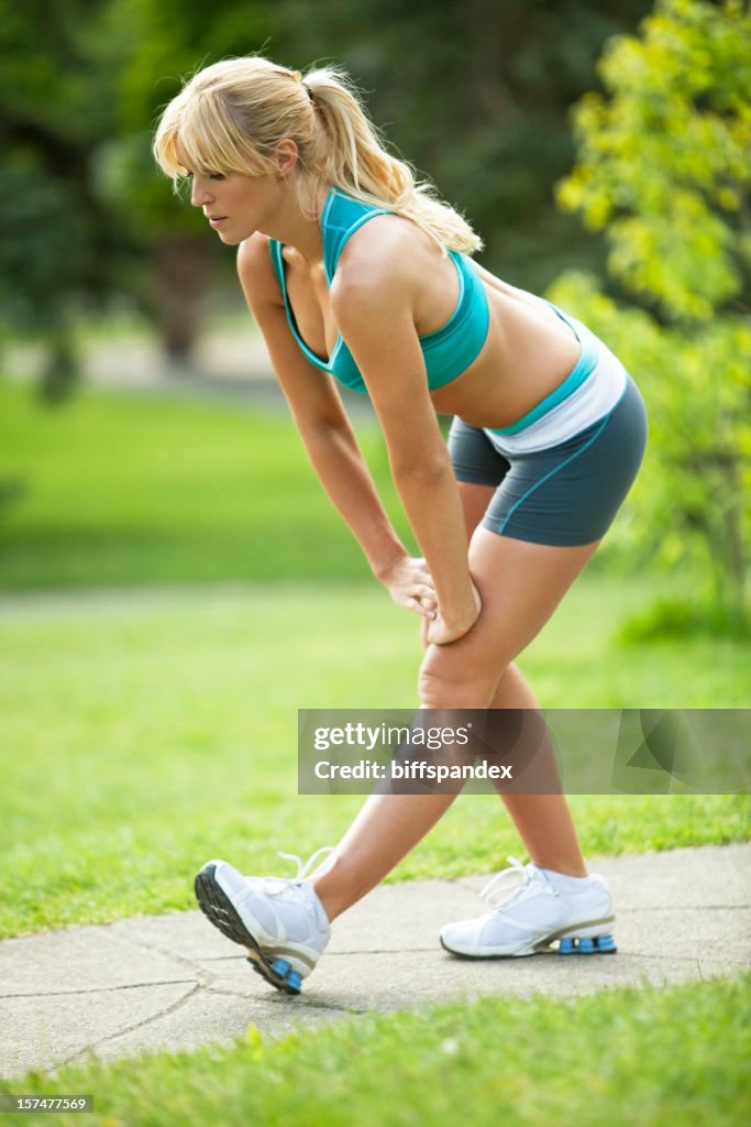 Female Runner Stretching