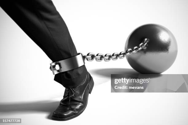 businessman with ball and chain - restraining device bildbanksfoton och bilder