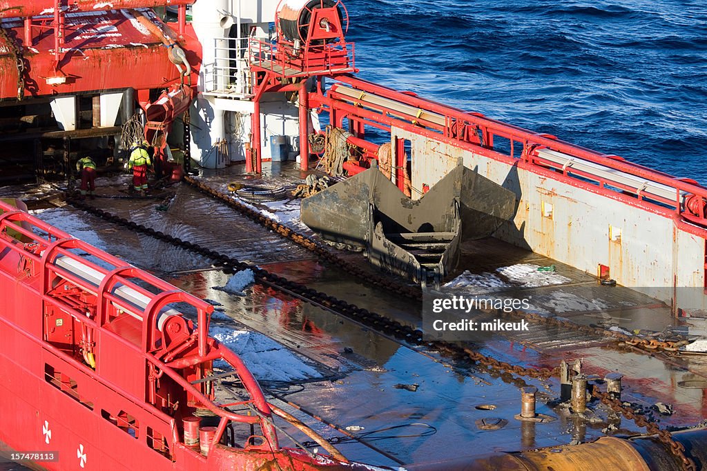 Oil rig anchor on support boat