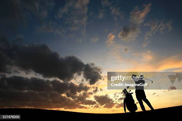 male senior golfer silhouette back view - golf swing sunset stock pictures, royalty-free photos & images