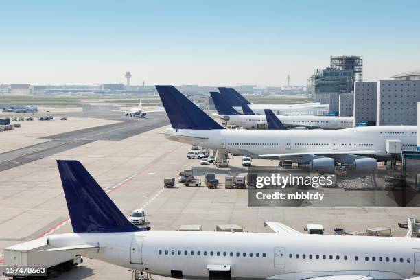 airplanes loading on airport - tarmac airport stock pictures, royalty-free photos & images