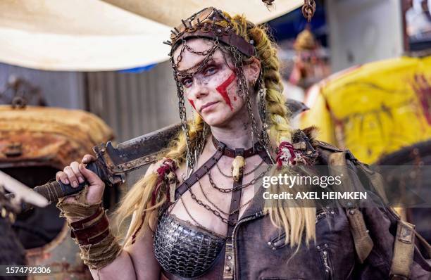 Resident of post-apocalyptic project 'Wasteland', a separate area on the Wacken Open Air's festival grounds, poses in Wacken, northern Germany on...