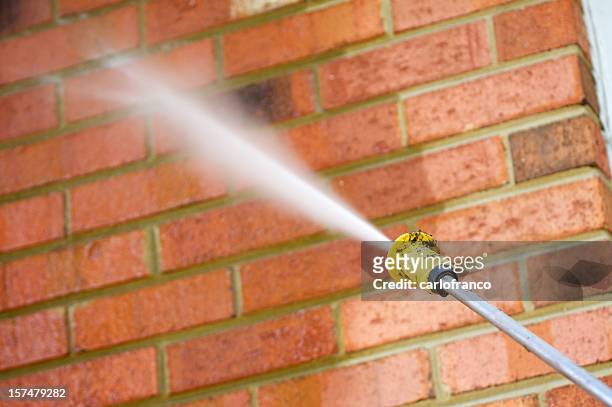 pressure washing a brick wall - cleaning walls stock pictures, royalty-free photos & images
