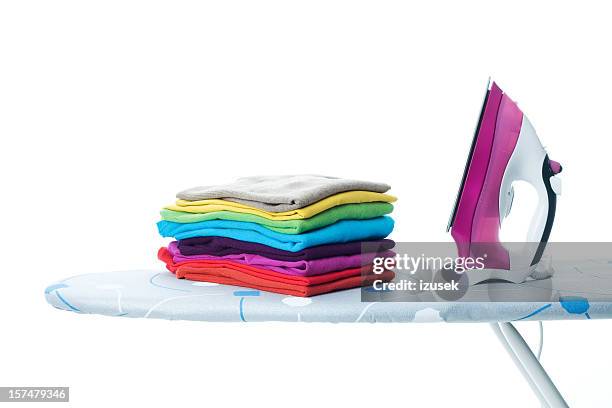 ironing chore - closet shelf of colorful folded clothes stockfoto's en -beelden