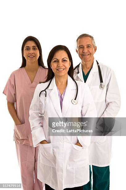 two female doctors, one male doctor, scrubs and lab coat - one in three people stock pictures, royalty-free photos & images
