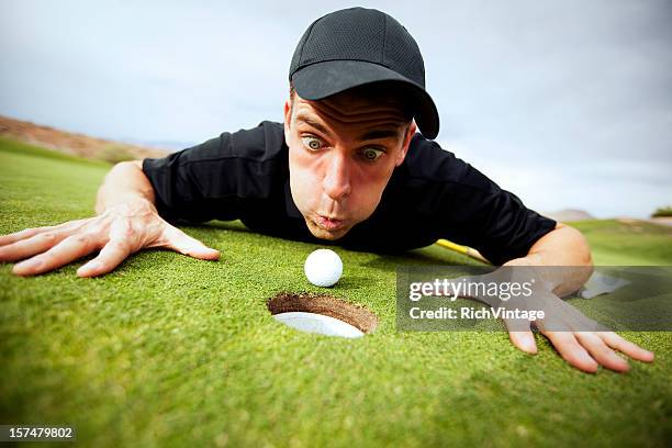 just get in the hole! - golf cheating stock pictures, royalty-free photos & images