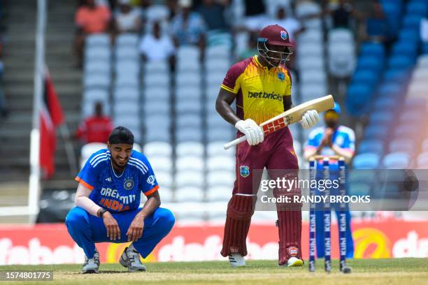 Arshdeep Singh of India celebrates the dismissal of Rovman Powell of West Indies during the first T20I match between West Indies and India at Brian...