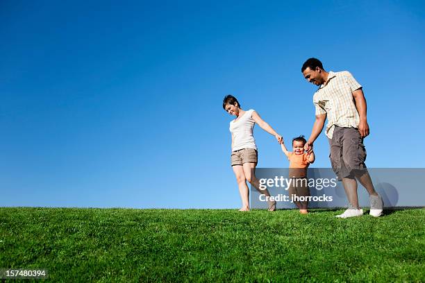 summer family stroll - young couple with baby stock pictures, royalty-free photos & images