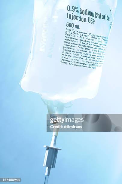 intravenous iv bag bolus drip with sodium chloride - saline drip stock pictures, royalty-free photos & images