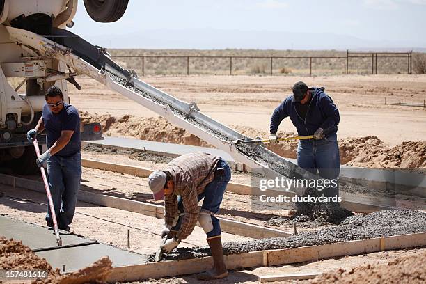 cement workers - solid foundations stock pictures, royalty-free photos & images