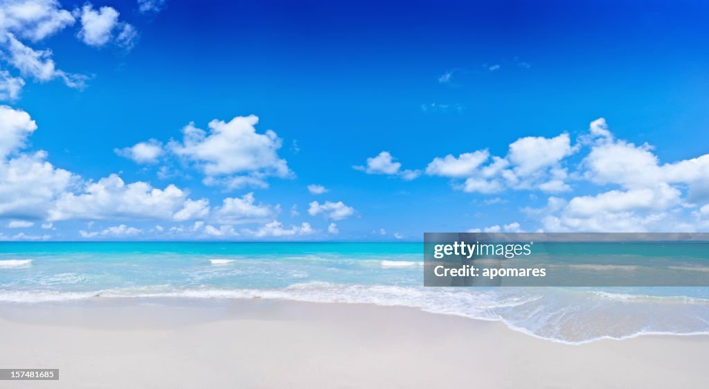 Tropical Beach and cloudy deep blue sky