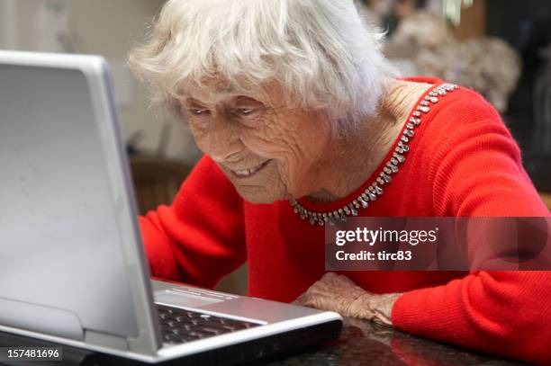 ninety year old lady on laptop - 90 year old stockfoto's en -beelden