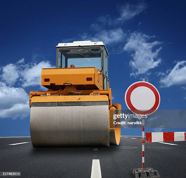 road roller at construction site - asphalt roller stock pictures, royalty-free photos & images