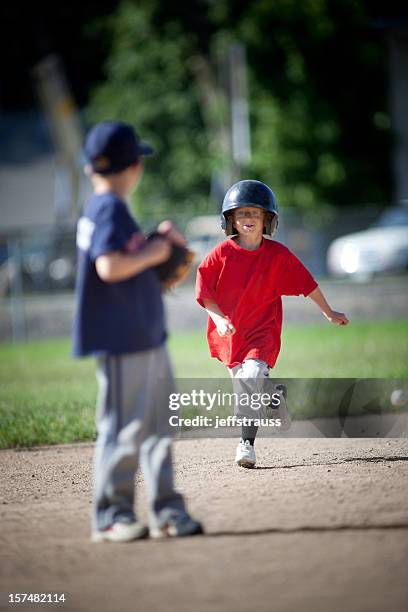 outrunning the ball - grounder stock pictures, royalty-free photos & images