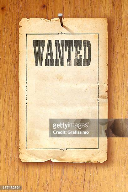 antique brown wanted poster fixed with nail on wooden background - wanted poster stock pictures, royalty-free photos & images