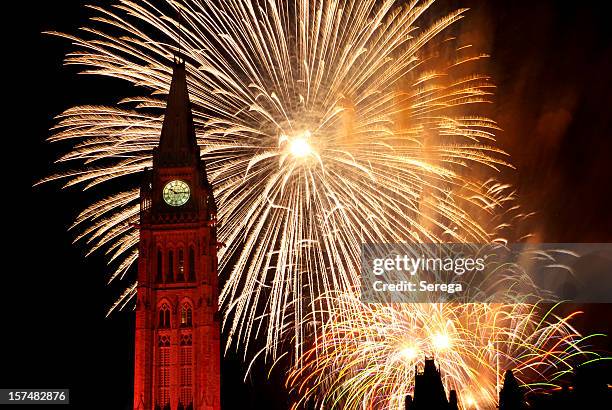 fireworks over the canadian parliament, ottawa on canada day - canada day celebration stock pictures, royalty-free photos & images