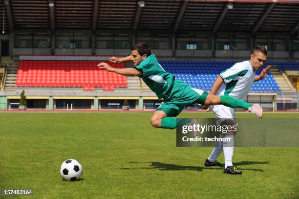 soccer player making foul - foul stock pictures, royalty-free photos & images